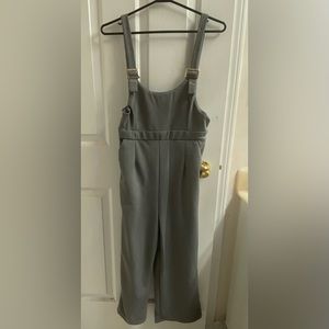 Jumpsuit small size, adjustment on shoulder with buckle comes with 3 loop holes.